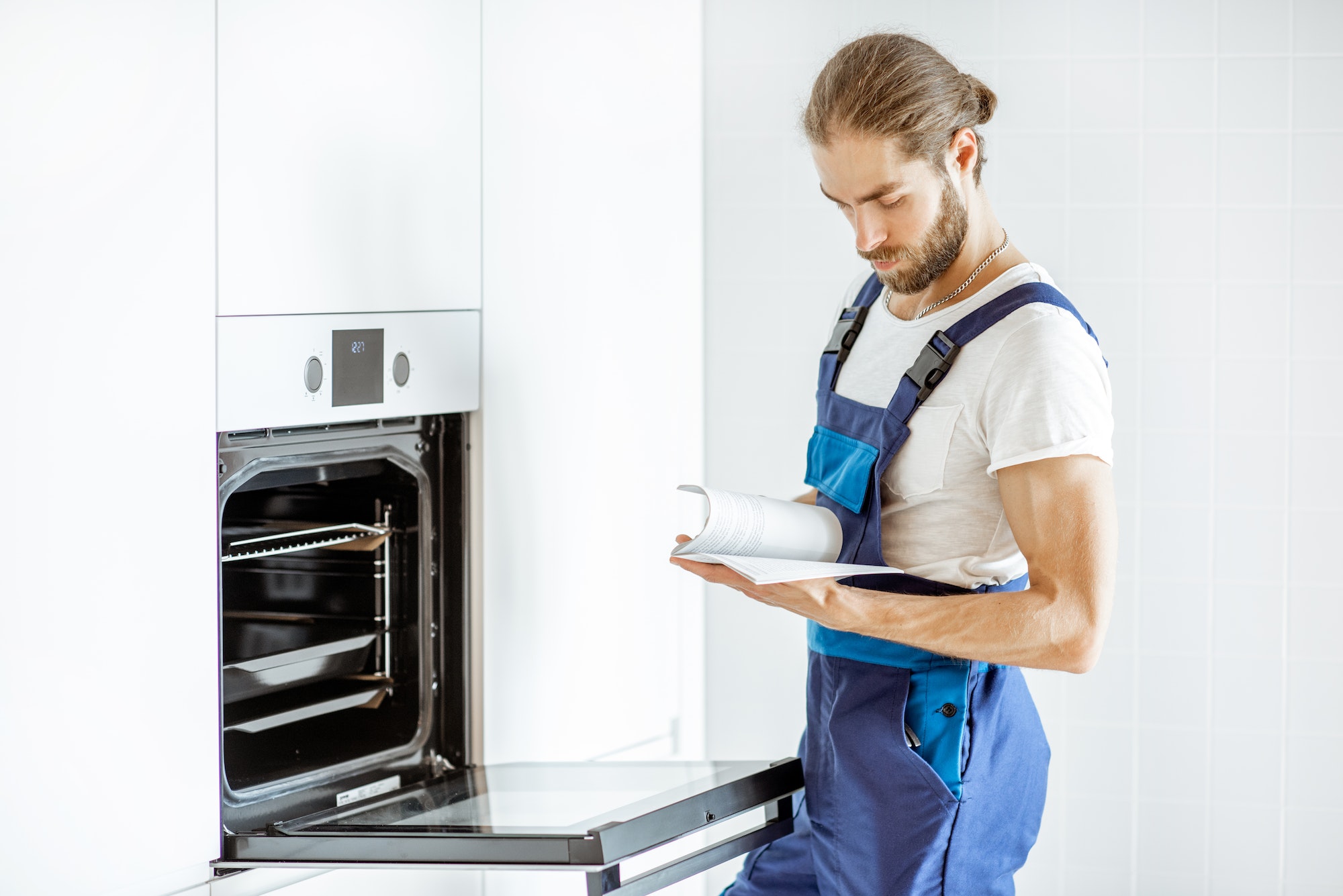 Workman setting up electric oven